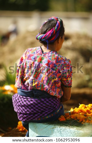 All Saints Day is a popular celebration in Guatemala. In Santiago Sacatepéquez, takes place the visit the tombs of the death loved ones and the and the traditional flying of giant colorful kites. Royalty-Free Stock Photo #1062953096