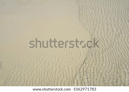 wave of water are moving on sand soil 