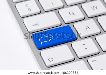 Keyboard with a single blue button showing the chat icon