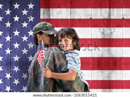 soldier and son in front of usa flag