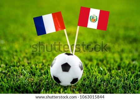 France - Peru, Group C, Thursday, 21. June, Football, World Cup, Russia 2018, National Flags on green grass, white football ball on ground.