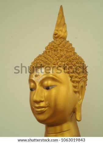 Golden buddha face at Wat Prot Ket Chettharam Temple in thailand.