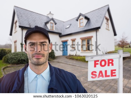 Portrait of security guard standing against house
