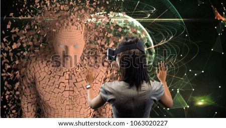 Businesswoman looking at 3d image through VR glasses