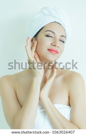 Beautiful spa woman with clean fresh skin touch own face, spa skin and body care, Facial treatment massage.