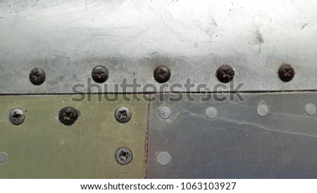Metal. Aluminum. Sheet metal with rivets. Metal plate with rivets