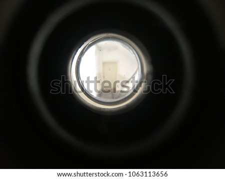 Looking trough peephole on door Royalty-Free Stock Photo #1063113656