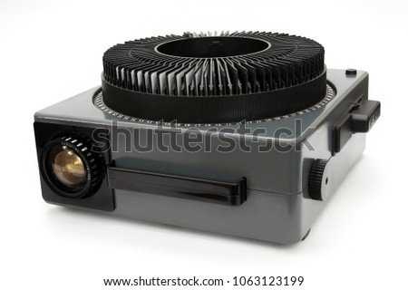 Old and vintage looking film projector on white background, shot in the studio