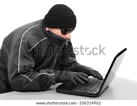 Dangerous hacker with laptop. Data security concept.