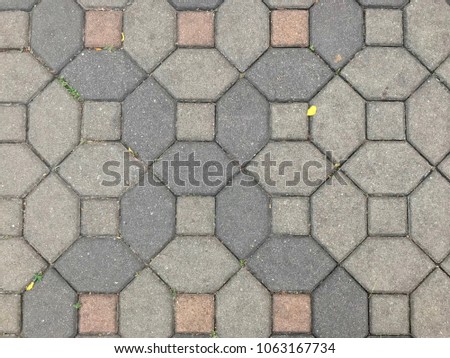Gray cement tile on walkway, outdoor pathway made from cement brick