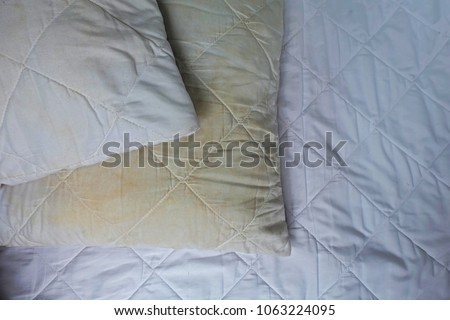 
Dirty pillows on white beds are a source of germs and dust mites and mattresses