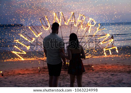 surprise propose merry me to wedding fire sunset  Royalty-Free Stock Photo #1063224998