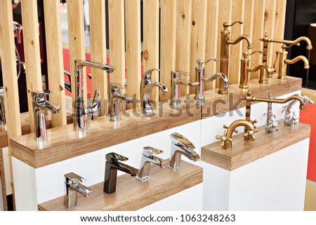 Plumbing and kitchen faucets at the exhibition in the store