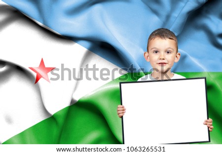 Cute small boy holding emtpy sign in front of flag of Dijbouti