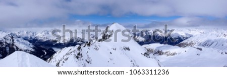 panorama winter mountain landscape with peaks and the lakes near St. Moritz in the background