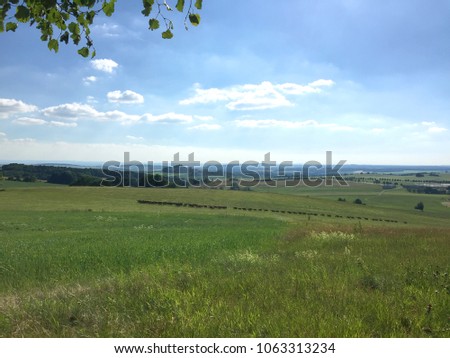 View to small town Stolpen in saxony, germany, with a flock of goats in front  Royalty-Free Stock Photo #1063313234