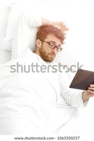 background image . modern man reading on digital tablet.