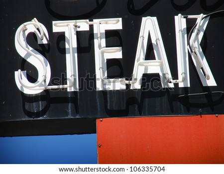    vintage steak neon sign