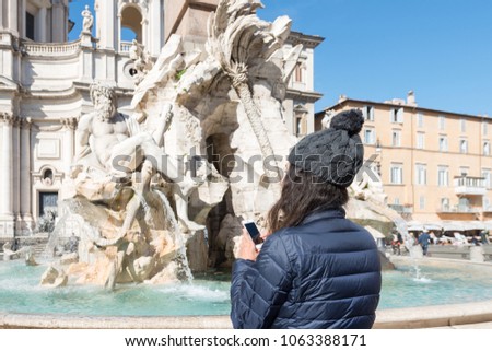 Horizontal picture of woman dressing winter clothes at Piazza Navona in Rome, Italy
