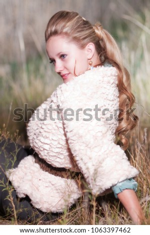 Young Caucasian Woman In High Fashion Photo Shoot Outside Off Camera Flash Strobe