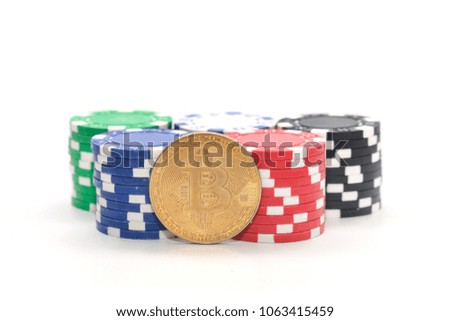 bitcoin on pile of casino chips on white background