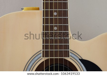 Acoustic guitar close up view, box guitar, body and strings