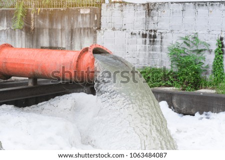 Drainage pipe with water flowing into the river