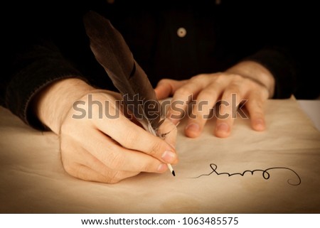 a man's hand holds the fountain pen and the signing of a contract closeup