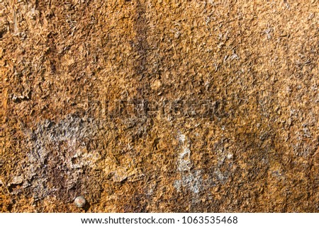 Detail of textured weathered old orange board , abstract background