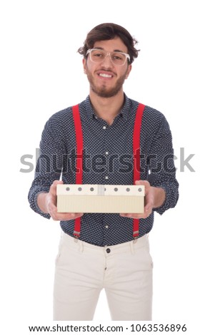 Young man raising his hands holding a gift box giving it to someone, isolated on a white background.
