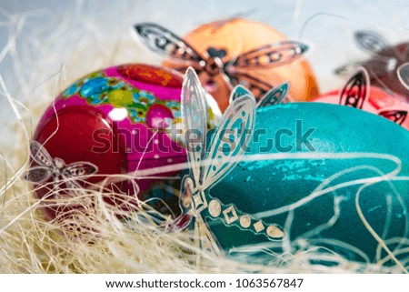 Easter eggs of various colors on a white background