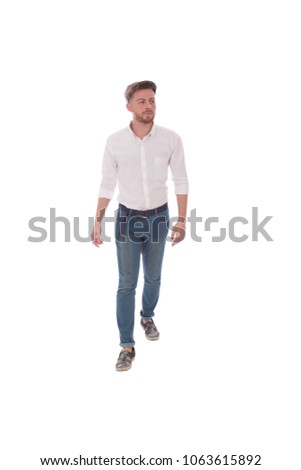 Full-length shot of a young man walking and looking away, isolated on a white background.
