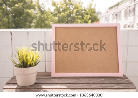 blank photo frame with copy space on balcony