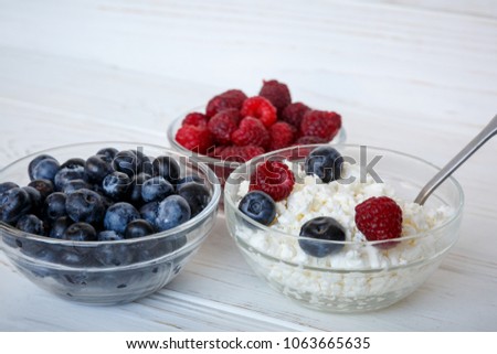 light summer breakfast or dessert with berries and cottage cheese. close up