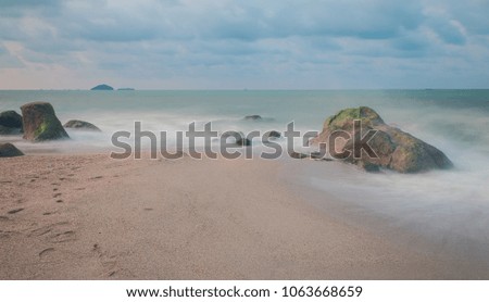 Long exposure shot.Sea scape with stone beach at sunset,Motion blur,slow shutter speed.