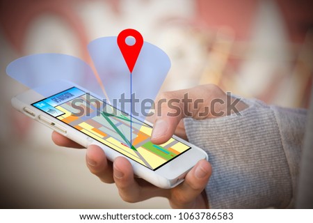 hand-held phone with gps or locator Royalty-Free Stock Photo #1063786583