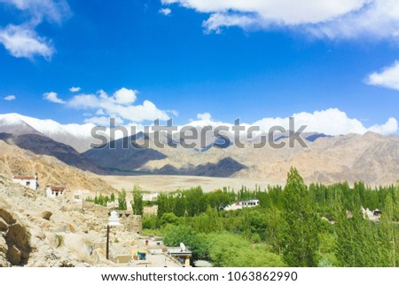Beautiful landscape view from Shey Palace. background with blue sky, clouds and Himalaya mountains in Ladakh,India. Indian Tibet region in Jammu and Kashmir,India.
