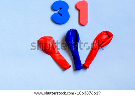 31celebrating red blue number with cute colorful balloons. Thirty one Modern alphabet digits on blue background. 31 th birthday party anniversary card.