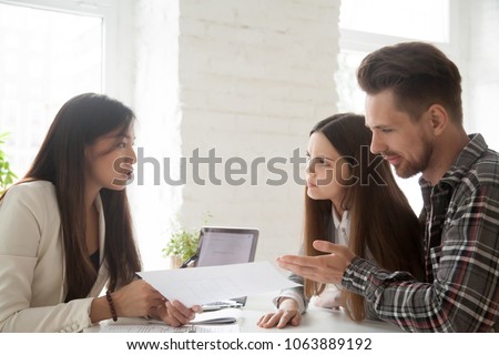 Asian lawyer consulting unconvinced angry deceived clients complaining on bad contract demanding compensation at meeting, skeptical doubtful customers having claims rejecting offer, fraud concept Royalty-Free Stock Photo #1063889192