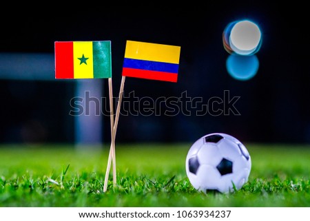 Senegal - Columbia, Group H, Thursday, 28. June, Football, World Cup, Russia 2018, National Flags on green grass, white football ball on ground.