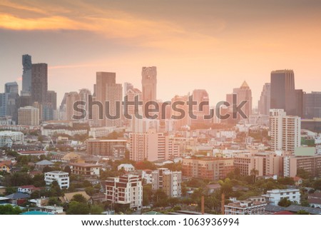Office building and residence downtown with after sunset sky background