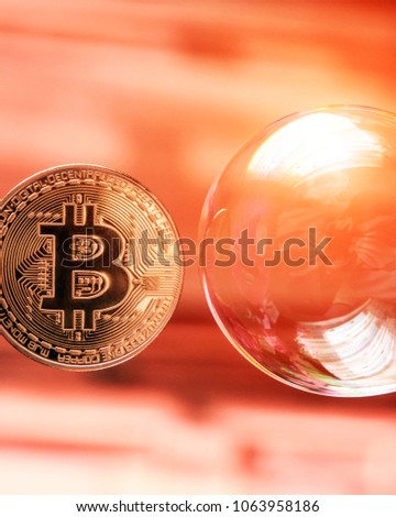 Bitcoin and the bubble as an abstract symbol of the risks of a digital currency and possible collapse and abrupt change of course (falling, collapse, fiasco, fraud - the concept)