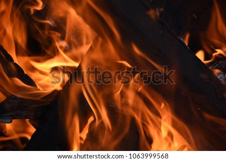 Burning fire from the camp glowing red and orange flames