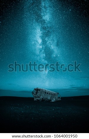 DC-3 plane wreck at night with milky way on the sky