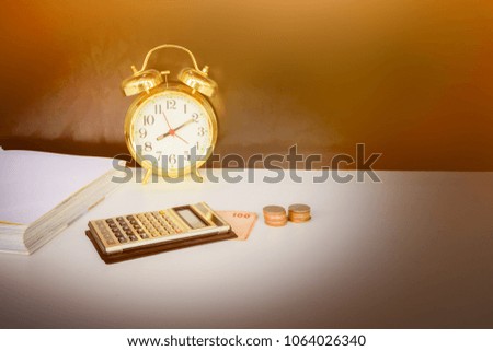 calculator, money and alarm clock old vintage gold over white and black background. with copy space add text retro style
