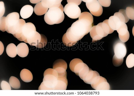 Golden and pink light bokeh circles, luxury background concepts.