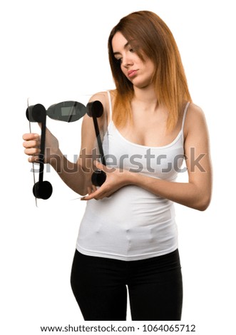 Sad beautiful young girl with weighing machine