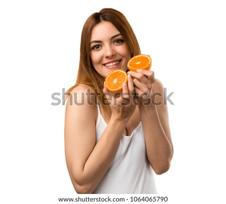 Beautiful young girl holding an orange juice