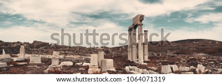 Pillars in historical ruins panorama in Delos Island near Mikonos, Greece. Royalty-Free Stock Photo #1064071319