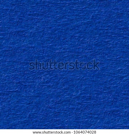 Bright blue paper texture with reliefs. Seamless square background, tile ready. High resolution photo.